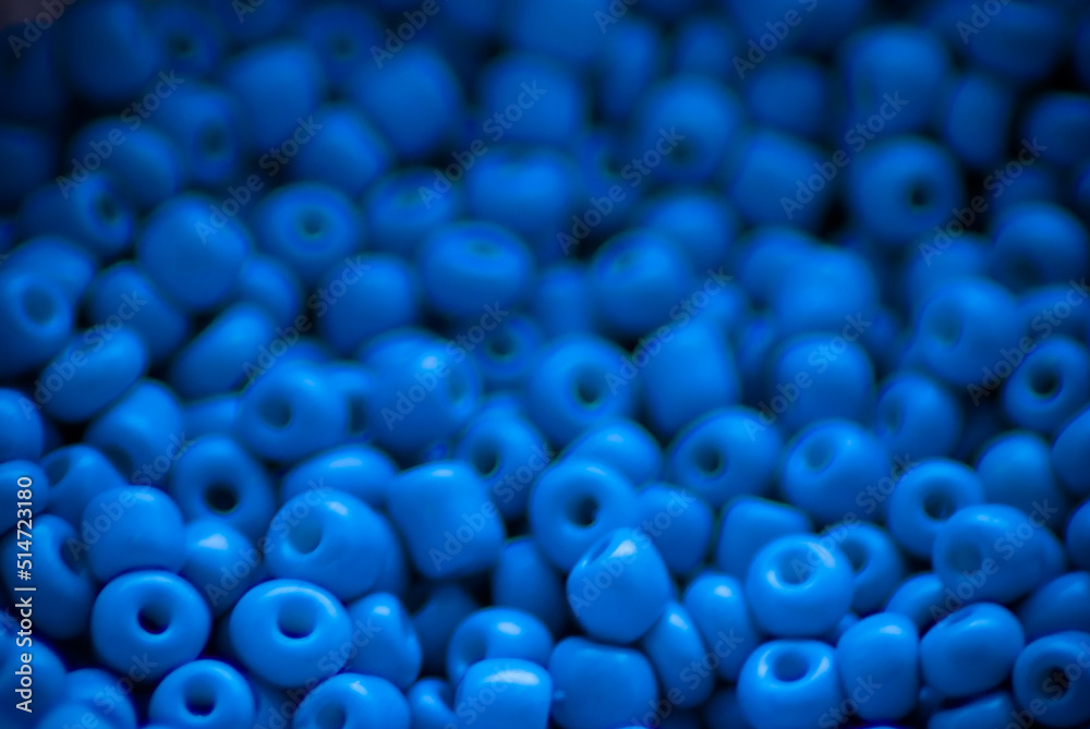 Blurred background of blue beads.
Blurred background of blue beads.