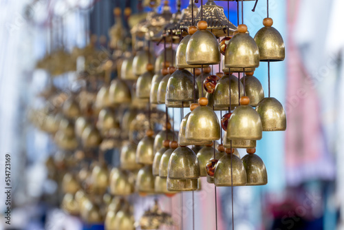 Small Brass bells hanging. Souvenir in Luang Prabang Night market, Laos.