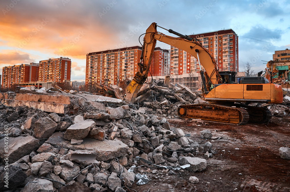 Excavator with crusher presses pile of reinforced cement Excavator with crusher presses pile of reinforced cement