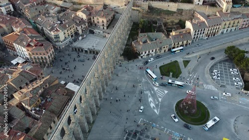 Aerial view of the Segovia aqueduct in Spain, with traffic and buses.  (ID: 514724954)
