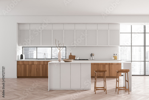 Light kitchen interior with island and seats  appliances and panoramic window