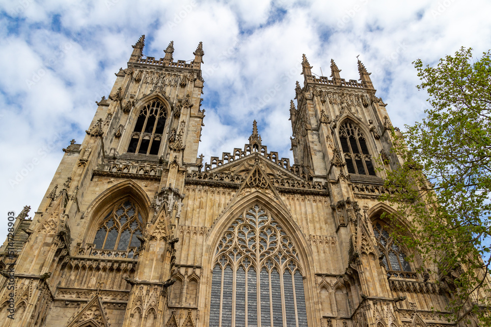 Fototapeta premium Close up exterior front view of The Cathedral and Metropolitical Church of Saint Peter, more commonly known as York Minster, in the city of York, England