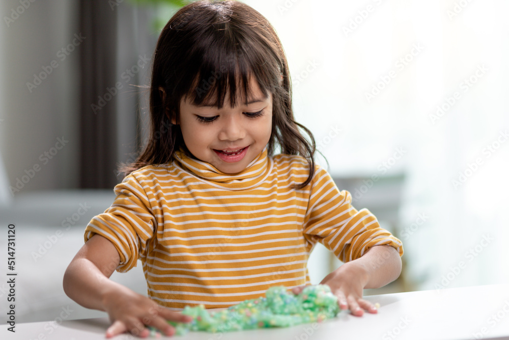 Kid play with handgum. Slime in children hands. Kid play with handgum. Slime in children hands.