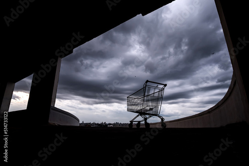 A shopping cart on a rooftop car park.