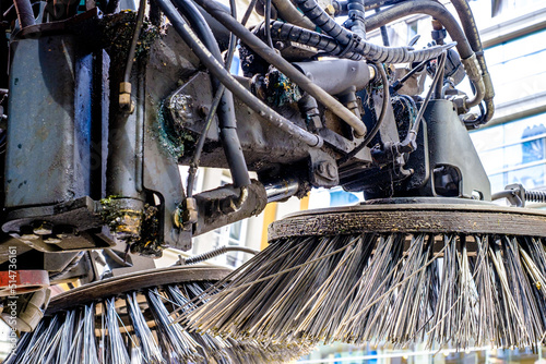 brooms of a street cleaning car photo