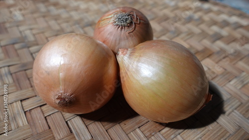 Onion or bawang bombay as raw material used for flavouring or ingredient of cuisine for cooking spices photo