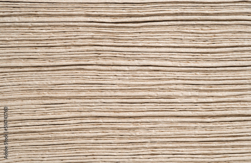 Light brown tissue paper laid out in layers. Wipe clean, pattern, texture, background.