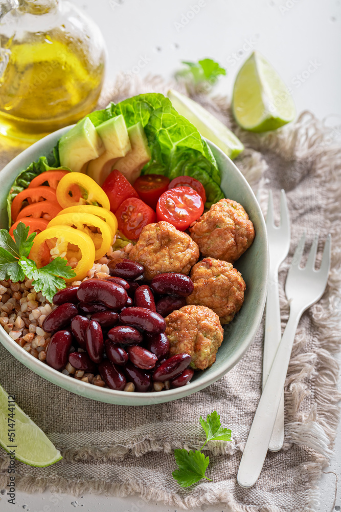 Wholesome Mexican salad with meatballs, beans, pepper and groats.