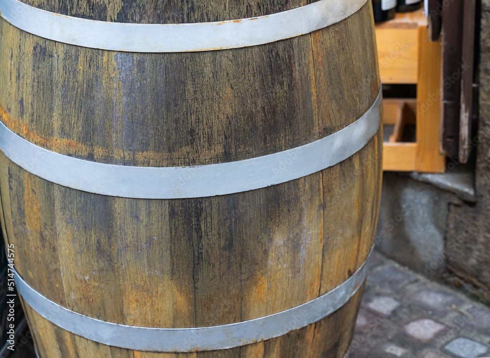 oak barrel close-up with steel rings close-up, old and weathered oak barrel close-up with steel rings close-up, old and weathered