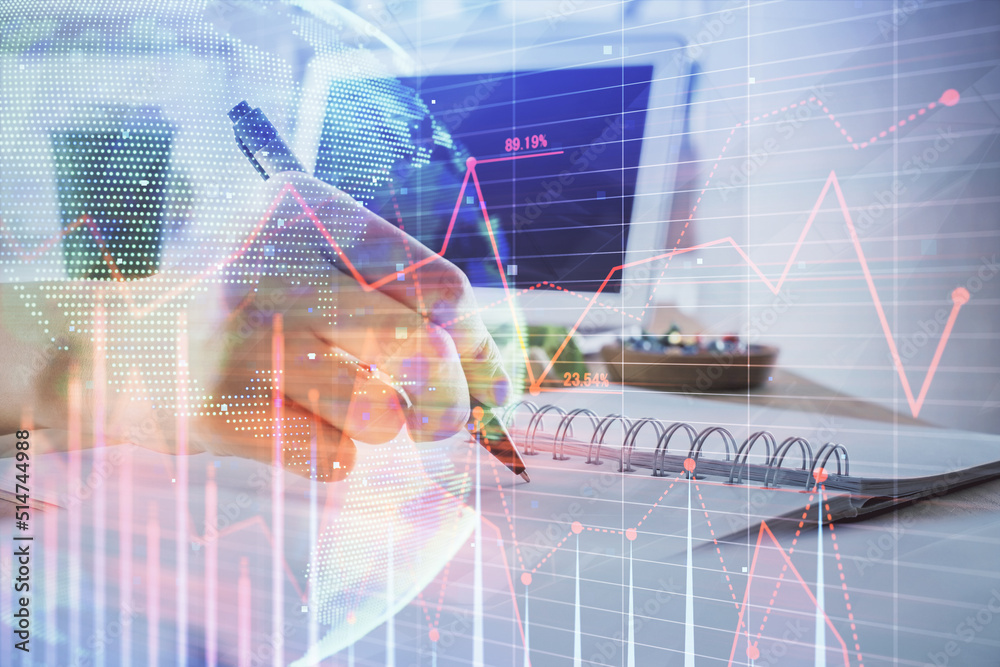 Financial forex graph drawn over hands taking notes background. Concept of research. Multi exposure Financial forex graph drawn over hands taking notes background. Concept of research. Multi exposure