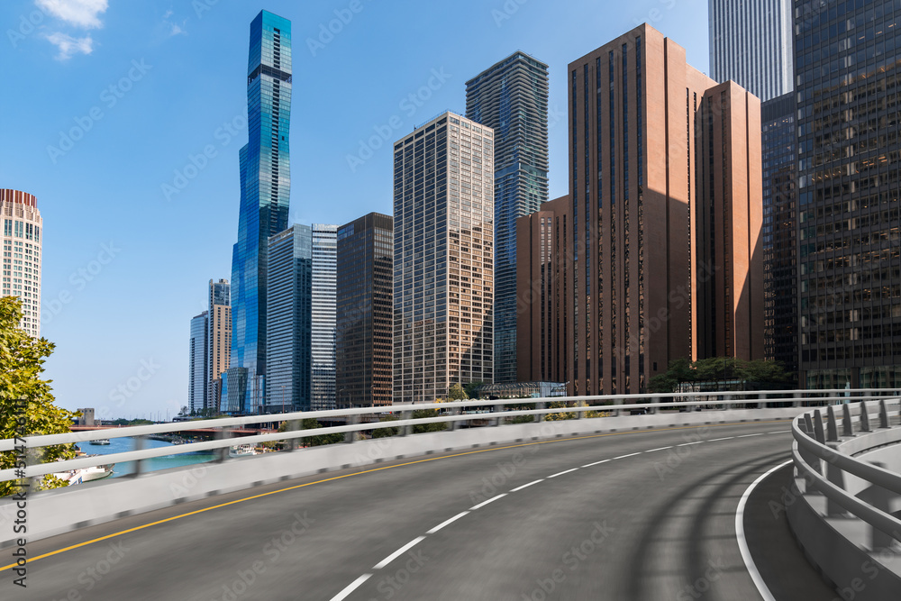 Empty urban asphalt road exterior with city buildings background. New modern highway concrete construction. Concept of way to success. Transportation logistic industry fast delivery. Chicago. USA. Empty urban asphalt road exterior with city buildings background. New modern highway concrete construction. Concept of way to success. Transportation logistic industry fast delivery. Chicago. USA.