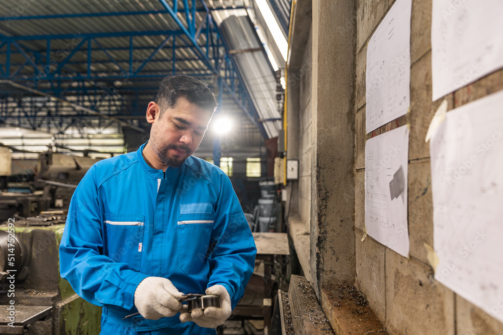Senior asian engineer man worker in protective uniform operating machine at factory Industrial.People working in industry. Senior asian engineer man worker in protective uniform operating machine at factory Industrial.People working in industry.