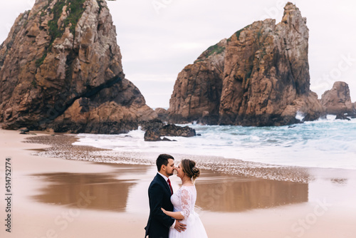 profile of the newlyweds in each other's arms on the background