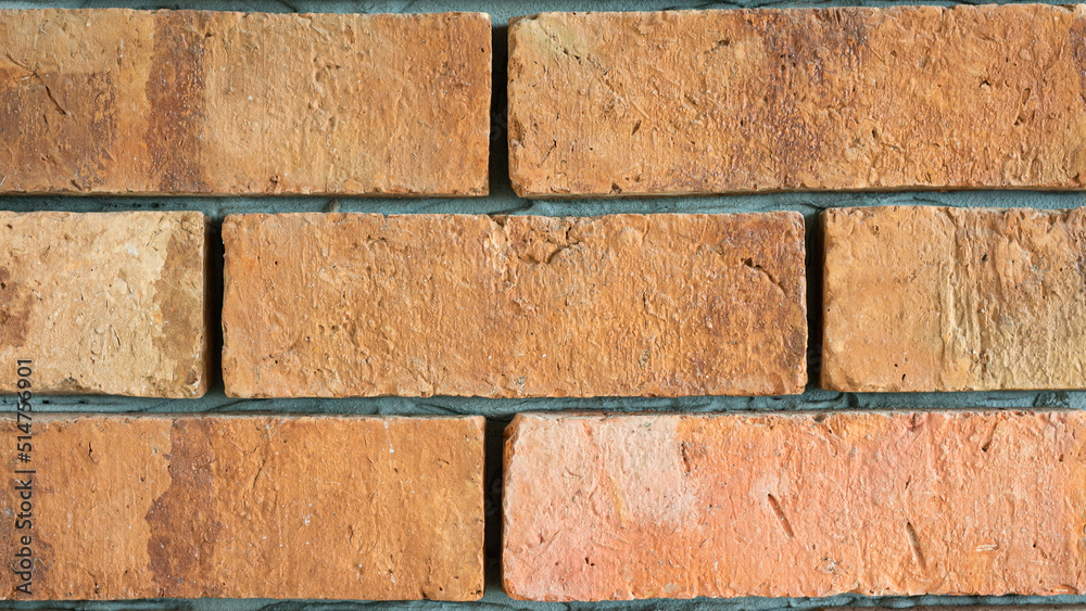 Naklejka premium Clay brick block structure wall surface. Interior decoration and background textured photo.
