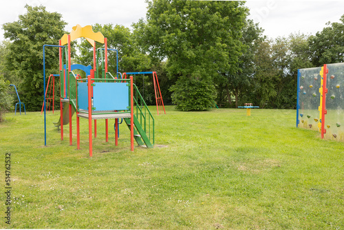 brightly coloured childrens outside play and climbing equipment