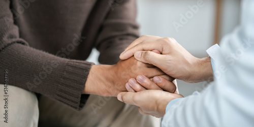 Male doctors shake hands with patients encouraging each other and praying for blessings. To offer love  concern  and encouragement while checking the patient s health. concept of medicine