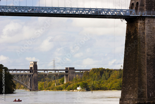 Beautiful view looking underneath the Menai Bridge and southwards along the Menai Strait towards the Britannia Bridge in the distance, Isle of Anglesey, North Wales