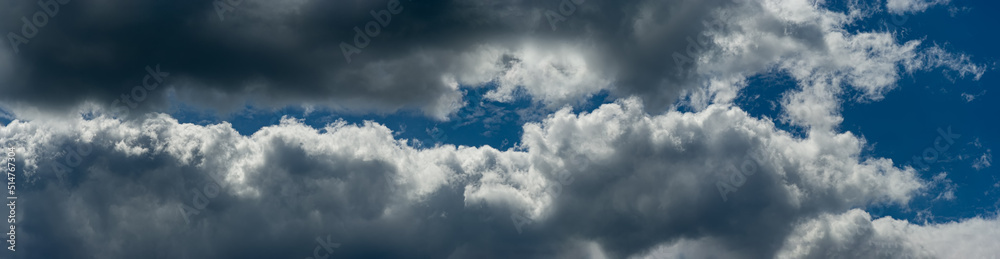 Blue sky between rain clouds. Web banner.
