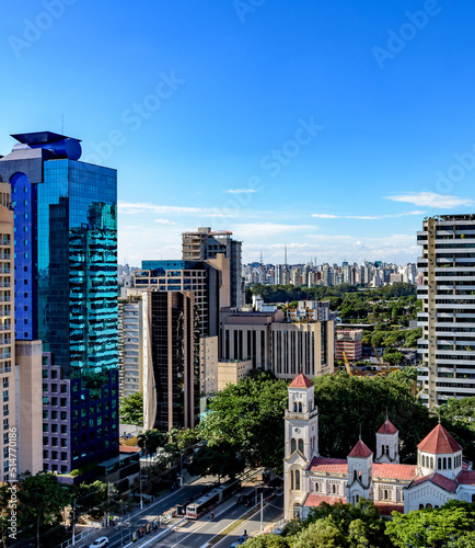 View of the modern city of São Paulo and its buildings forming a wall of buildings in the background on a sunny day photo