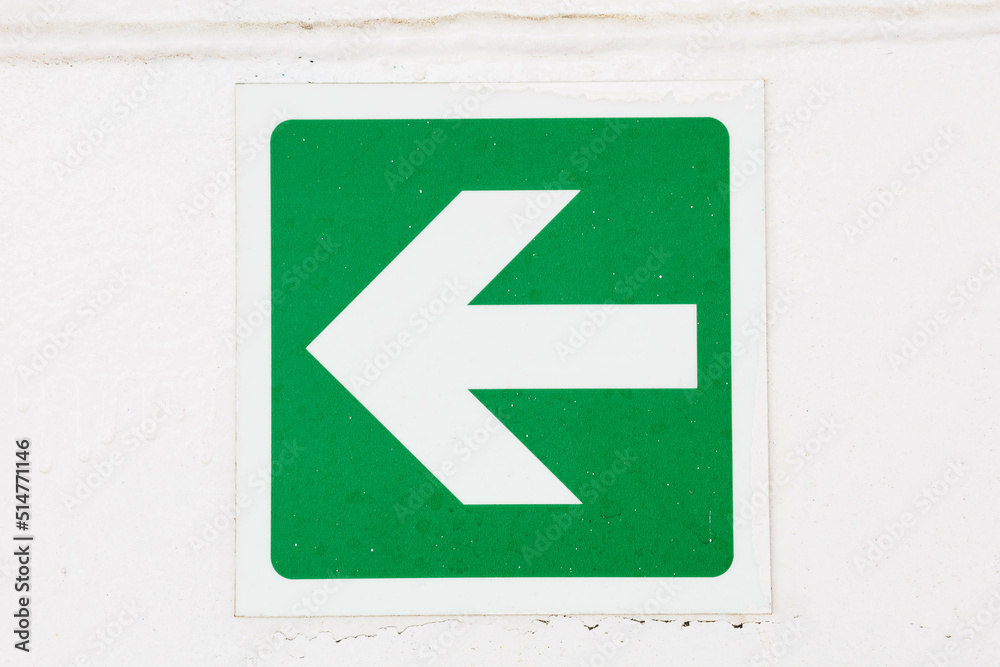 Green arrow escape sign pointing to the left Green arrow escape sign pointing to the left