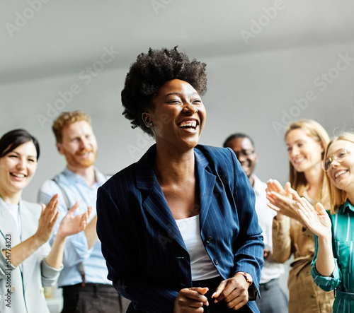 business meeting businesswoman woman success congratulating happy clapping applause teamwork greeting introduction celebrating office happy young