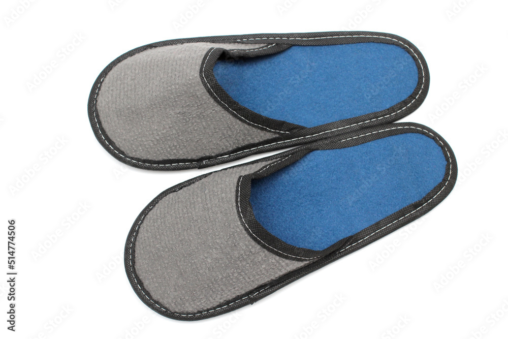 Gray textile slippers with blue insole, house slippers isolated on white background, home clothes, top view Gray textile slippers with blue insole, house slippers isolated on white background, home clothes, top view