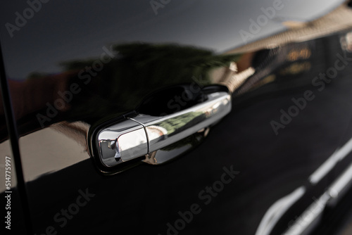 Car door handle on driver's door of modern black car. High quality photo © Andriy Medvediuk