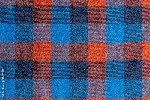 Abstract blue and red checkered fabric background or texture