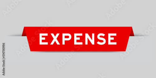 Red color inserted label with word expense on gray background