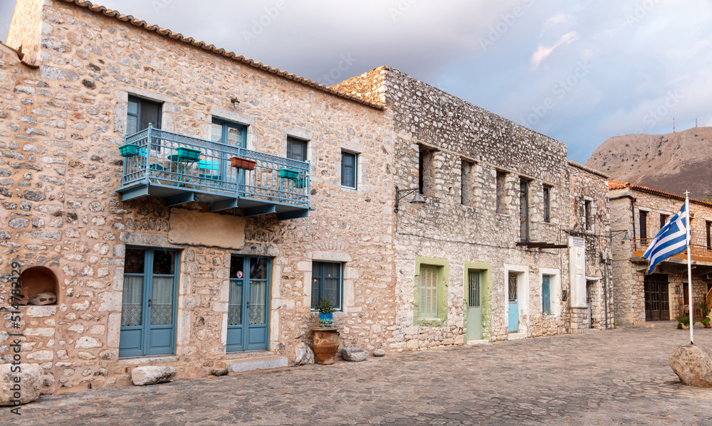 Greece. Areopoli village, Mani Laconia, Peloponnese. Stone building, paved street, historic square.