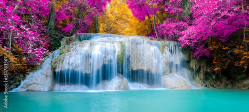 Amazing in nature  beautiful waterfall at colorful autumn forest in fall season