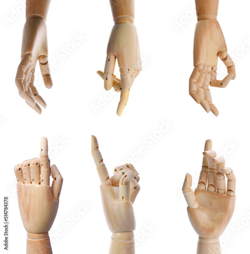 Set with wooden hands of mannequins showing different gestures on white background photo