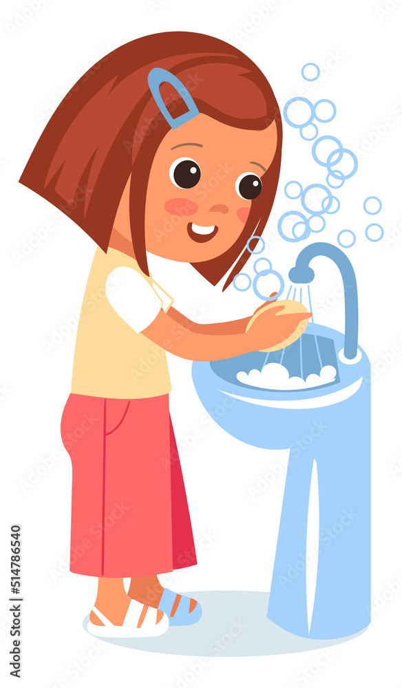 Child washing hand in sink with soap bubbles around