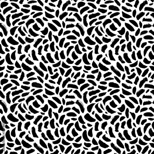 Abstract pattern of bold black shabby dots or spots on white background. Speckles of different size texture. Chaotic ink brush scribbles decorative texture. Monochrome hand drawn ornament.