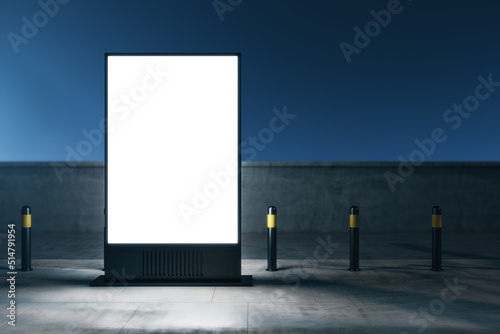 Marketing and promotion concept with front view on blank white illuminated street poster with space for your logo or text on empty night city background. 3D rendering, mock up photo