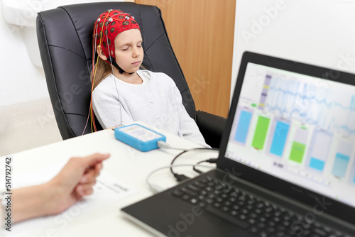 Focus on a patient with eyes closed during a biofeedback therapy