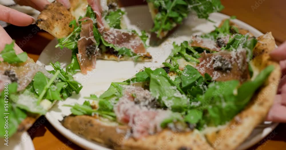 Friends enjoy pizza in restaurant Friends enjoy pizza in restaurant