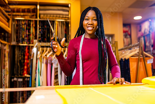 latino spain salewoman in storage update cotton and lace fabric showroom photo