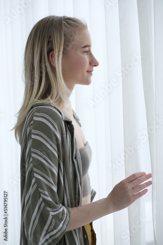 Portrait of blonde woman smiling at camera. Portrait of smiling cheerful beautiful pretty  caucasian woman. © Montri