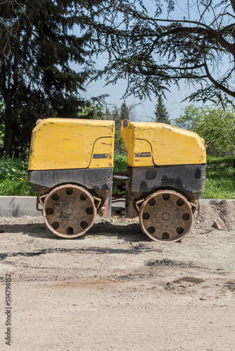 Asphalt machine that is on the road and is ready to work. © Petko