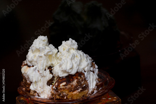 Hungarian sponge cake with whipped cream on a table photo