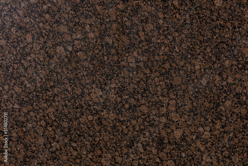 Baltic Brown Granite background, texture in unique tone for design project. Slab photo.