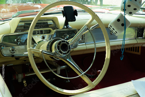 Interior view of old vintage car. View on dashboard of classic car