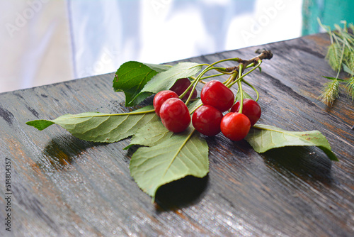 Fresh red cherries fruit on wooden background close up. High quality photo