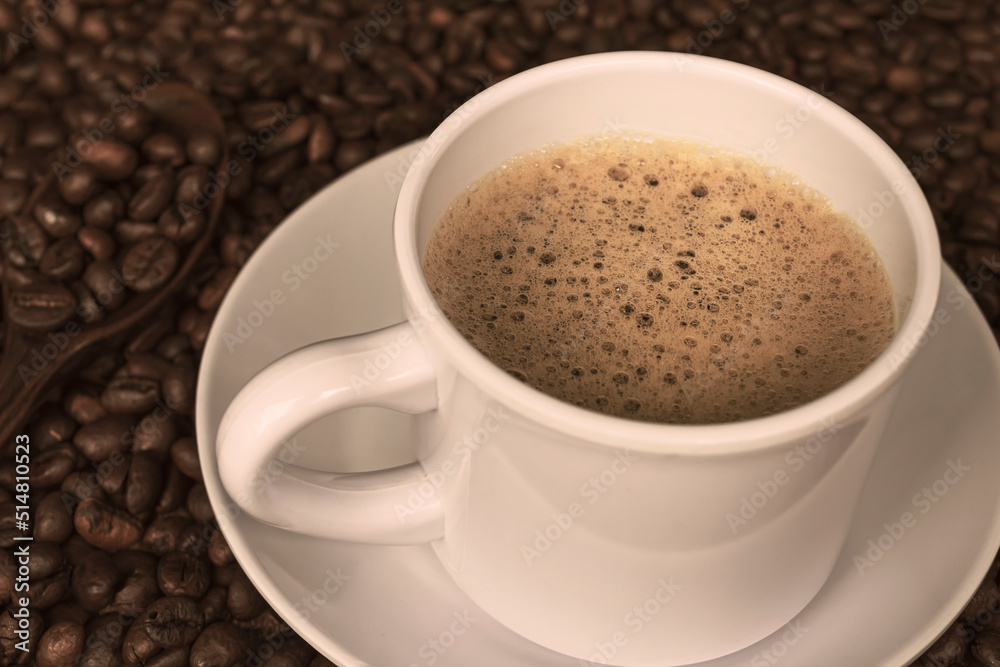 Cup of coffee and coffee beans background. Food and beverage concept. Copy space Cup of coffee and coffee beans background. Food and beverage concept. Copy space