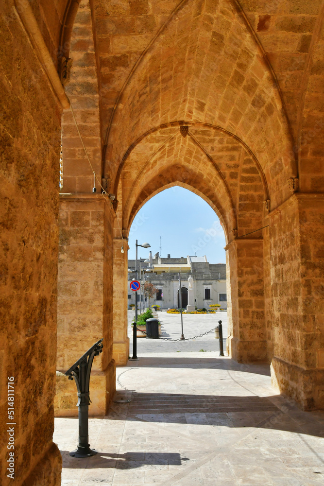 The arches of a portico leading to the town square of Uggiano, a medieval village in the Puglia region of Italy.