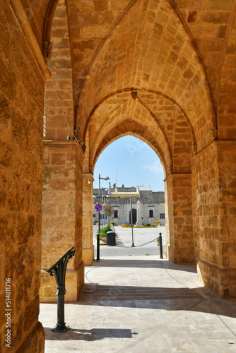 The arches of a portico leading to the town square of Uggiano, a medieval village in the Puglia region of Italy.