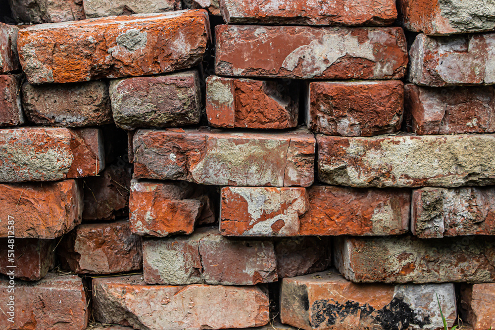 Texture of old red bricks. Stacked old red bricks as background for your image. Construction material. Texture of old red bricks. Stacked old red bricks as background for your image. Construction material.