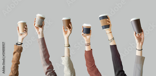 Fotomurale Many different arms raised up holding coffee cup