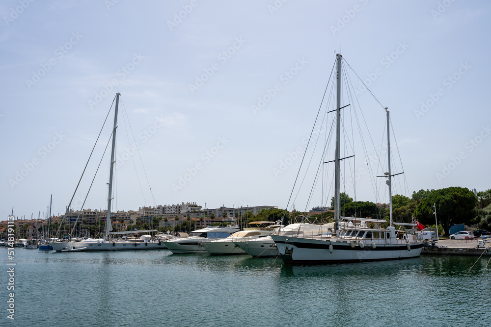 Sleek and modern sailboats and motor boats in a central marina in Antibes, France. Yachts and speed boats in the port.